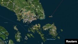 A map shows the location where the Alnic MC merchant vessel came to a halt after a collision with the guided-missile destroyer USS John S. McCain east of Singapore August 21, 2017.