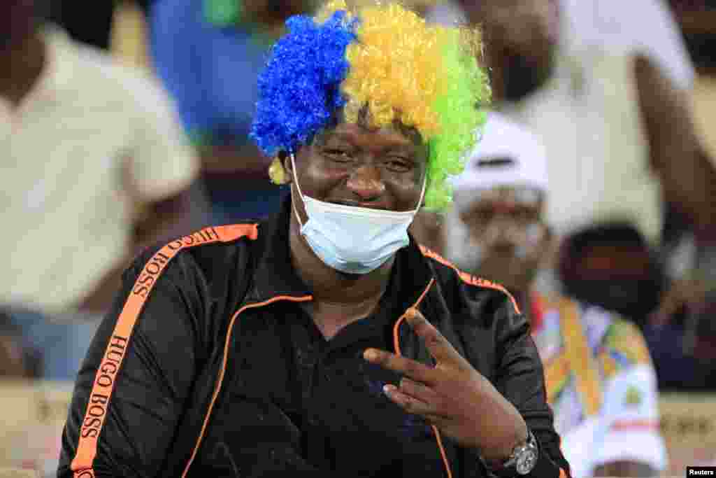 A Gabonese fan poses before the match.