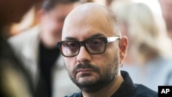 FILE - Russian theater and film director Kirill Serebrennikov waits for the start of hearings in a court in Moscow, Russia. 