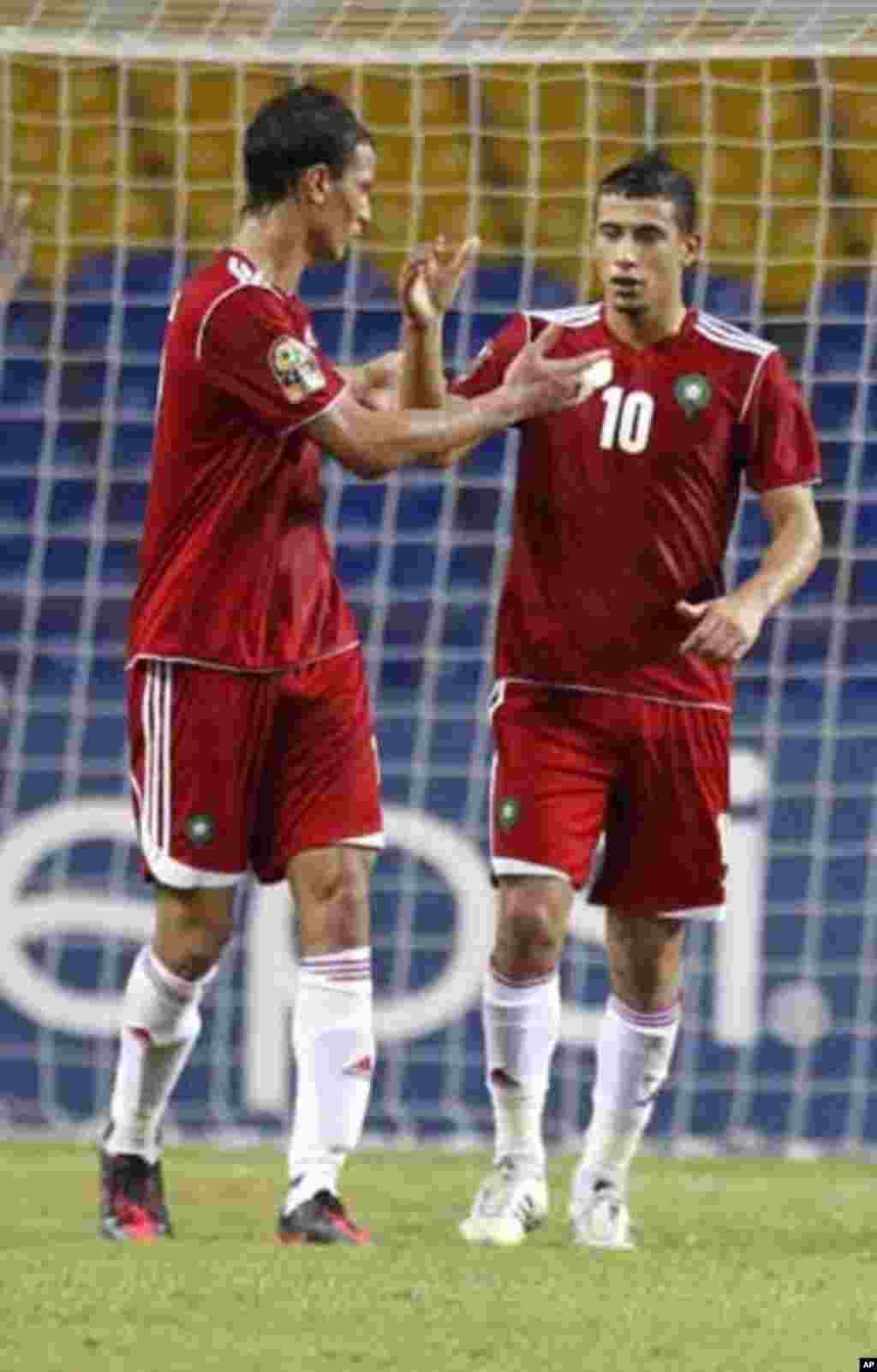 Morocco's Younes Belhanda (10) celebrates his goal against Niger with teammate Marouane Chamakh during their African Cup of Nations Group C soccer match at the Stade De L'Amitie Stadium in Libreville, Gabon January 31, 2012.