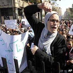 Women chant anti-military council slogans during a protest near the People's Assembly building in Cairo February 5, 2012.