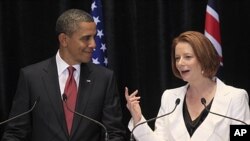 US President Barack Obama listens to Australian Prime Minister Julia Gillard during a joint press conference in Canberra, Australia, November 16, 2011.