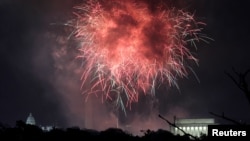 FILE - Fireworks explode over the U.S. Capitol (L), the Washington Monument (C) and the Lincoln Memorial (R) in celebration of the 241st anniversary of the Declaration of Independence and the 4th of July holiday in Washington, July 4, 2017. 
