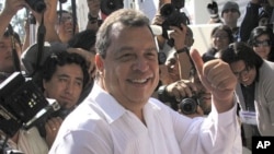 Aguirre gestures before casting his vote in Chilpancingo , January 30, 2011