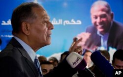 FILE - Mohammed Anwar Sadat, nephew of Egypt's late leader Anwar Sadat and the leader of Reform and Development Party, speaks during a press conference at the party headquarters, in Cairo, Egypt, Jan. 15, 2018. Egyptian President Abdel-Fattah el-Sissi ran virtually unopposed in that week's elections after a series of potentially serious candidates were arrested or withdrew from the race under pressure. Sadat said he quit the race because the climate was not conducive for campaigning and because he feared for the safety of his supporters.