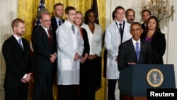 U.S. President Barack Obama (R) speaks about the government's Ebola response from the East Room of the White House in Washington, Oct. 29, 2014. Dr. Kent Brantly is on the far left.