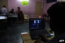 FILE - A technician checks a cctv camera. Use of surveillance cameras are becoming a solution to increase security.