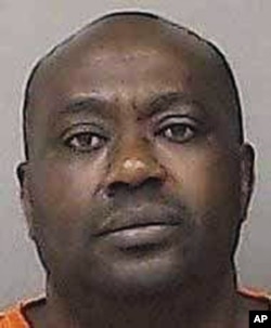 This undated photo provided by the Linn County Jail in Cedar Rapids, Iowa, shows Gervais Ngombwa. A federal judge sentenced Ngombwa March 2, 2017, for lying to gain citizenship in the U.S. after helping carry out deadly attacks during the country’s 1994 genocide.