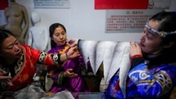 Ethnic Hezhen You Wenfeng's Chinese Han students learn how to make clothes from fish skin at You's studio in Tongjiang, Heilongjiang province, China December 31, 2019.