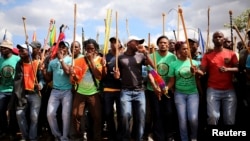 Mine workers gather at Wonderkop stadium outside the Lonmin mine in Rustenburg, northwest of Johannesburg, Jan. 29, 2014. 