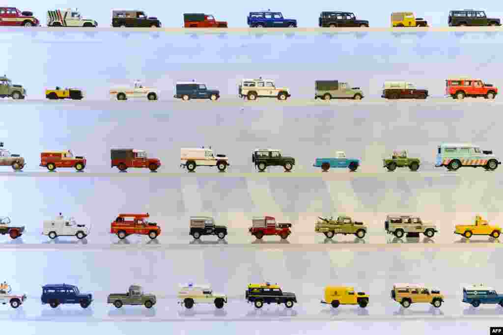 Models of varying incarnations of the Land Rover Defender off-road vehicles are displayed during an exhibition to promote the forthcoming charity auction of the two-millionth Land Rover Defender at Bonhams auctioneers in London.