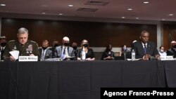 Defense Secretary Lloyd Austin (R), and Chairman of the Joint Chiefs of Staff Gen. Mark Milley (L), testify before the Senate Armed Services Committee on Afghanistan, on Capitol Hill in Washington, Sept. 28, 2021.