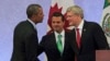 U.S. President Barack Obama (L) shakes hands with Canada's Prime Minister Stephen Harper (R) as Mexico's President Enrique Pena Nieto looks on after attending a news conference, at the North American Leaders' Summit in Toluca near Mexico City, Feb. 19, 20