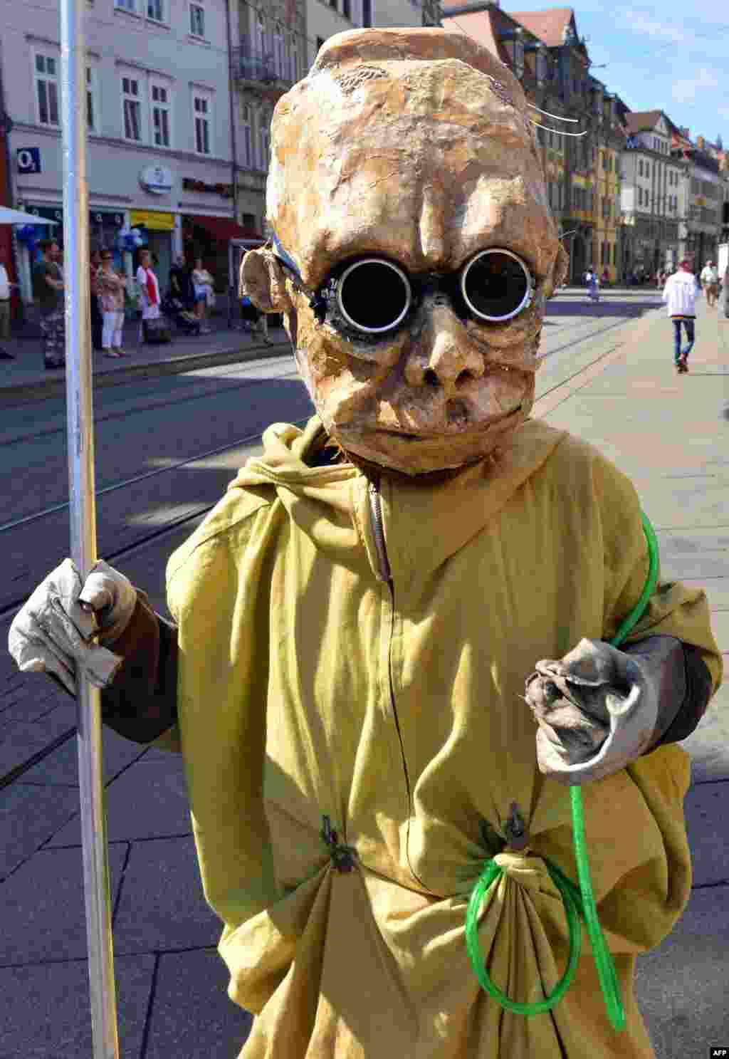 A costumed student of the art of puppetry is pictured during the presentation of the production of &quot;anti-corrosion&quot; in Erfurt, eastern Germany, during the puppet theater festival &quot;Synergura.&quot;