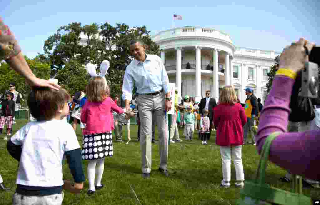 President Barack Obama attends the opening of the annual Easter Egg Roll festivities at the White House in Washington, April 9, 2012. (AP)