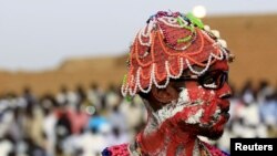 A wrestler from the Nuba Mountains tribe participates in a celebration of their cultural heritage, as part of ongoing events to commemorate the International Day of the World's Indigenous Peoples, in Omdurman August 15, 2015. 