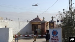 FILE - Pakistani police officers stand guard outside a police training center which was attacked by militants in Quetta, Pakistan, Oct. 25, 2016.