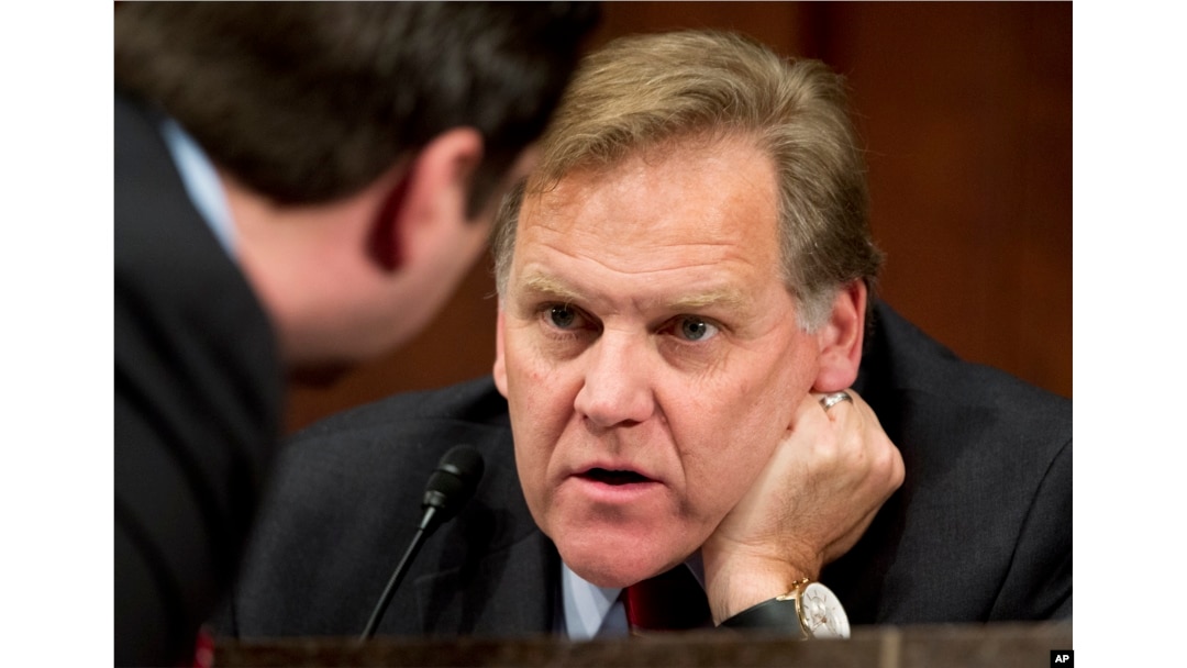 FILE - Then-House Intelligence Committee Chairman Mike Rogers, R-Mich., confers with a fellow committee member on Capitol Hill, April 2, 2014.