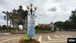 An ASEAN sign and flags at the Patuxai, a war monument known as Victory Gate. (M. A. Salinas/VOA)