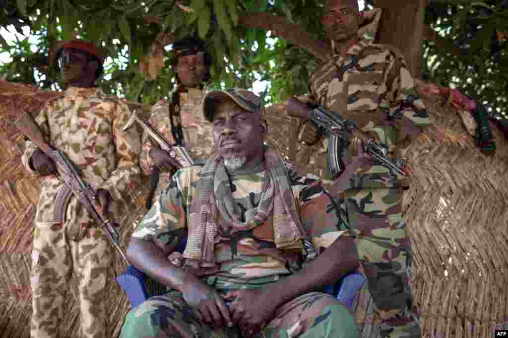 The self-proclaimed General Ahamat Bahar, ex-Seleka, ex-FPRC (Front populaire pour la renaissance de la Centrafrique), and now leader of the armed group MNLC, poses for photographs in front of his home in Betoko, northern Central African Republic.