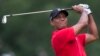 Tiger Woods watches his shot from the third tee during the final round of the Wyndham Championship golf tournament at Sedgefield Country Club in Greensboro, N.C., Sunday, Aug. 23, 2015. 