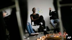 Shanee Smith, program manager of "Sisters in Strength," talks to survivors of sexual violence and their supporters in the Brooklyn borough of New York, March 14, 2019.