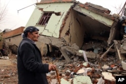 FILE - A resident walks on the rubble of a destroyed house in the mostly-Kurdish town of Silopi, Turkey, Jan. 19, 2016. Failed talks led Turkey's president to rule out any further peace efforts with Kurdish rebels.