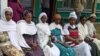 Latrines, safe delivery of babies and children's vaccinations are this Dosha health 'army's' normal discussion agenda. (VOA/Joana Mantey)