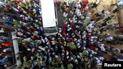 Demonstrators in Abuja protest the elimination of a popular fuel subsidy that has doubled the price of oil in Nigeria, January 11, 2012.