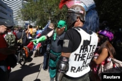 Members of the right-wing Patriot Prayer group gather before a rally in Portland, Ore., Aug. 4, 2018.