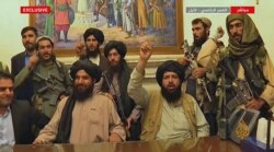 An image grab taken from Qatar-based Al-Jazeera television on August 16, 2021, shows Members of Taliban taking control of the presidential palace in Kabul after Afghanistan's president flew out of the country.
