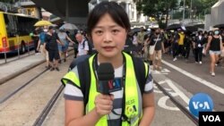 VOA Mandarin service reporter, Yihua Lee, on the streets of Hong Kong.