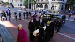 The coffin carrying the remains of Anglican Archbishop Emeritus Desmond Tutu arrives at St. George's Cathedral, Dec. 31, 2021, where he was to lie in state for a second day in Cape Town, South Africa. Tutu died Sunday at age 90.