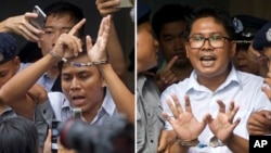 In this combination image made from two photos, Reuters journalists Kyaw Soe Oo, left, and Wa Lone, are handcuffed as they are escorted by police out of the court Monday, Sept. 3, 2018, in Yangon, Myanmar. (AP Photo/Thein Zaw)