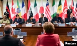 FILE - Participants attend the second working session of the G7 summit in Kruen, Germany, June 8, 2015, where leaders vowed to keep sanctions against Russia in place.