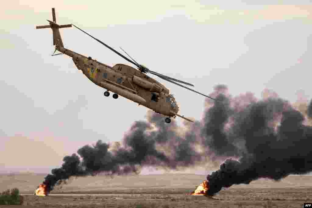 An Israeli Sikorsky CH-53K helicopter performs during an air show at the graduation ceremony of Israeli air force pilots at the Hatzerim Israeli Air Force base in the Negev desert, near the southern Israeli city of Beer Sheva.