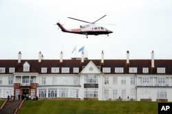 FILE - Presidential contender Donald Trump leaves by his helicopter on the third day of the Women's British Open golf championship at the Turnberry golf course in Turnberry, Scotland, Aug. 1, 2015.