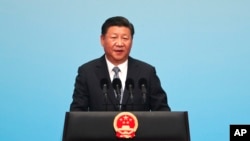 Presiden China Xi Jinping berbicara pada pembukaan Forum Bisnis BRICS di Xiamen International Conference and Exhibition Center di Xiamen, provinsi Fujian, China, Minggu, 3 September 2017. (AP Photo/Mark Schiefelbein, Pool)
