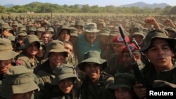 Venezuela's President Nicolas Maduro poses for a photo with soldiers during his visit to a military training center in El Pao, Venezuela, May 4, 2019. 