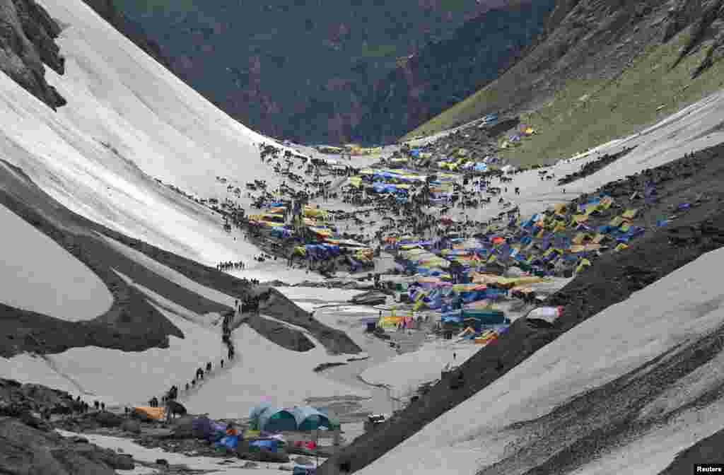 Hindu pilgrims arrive to worship at the holy cave of Lord Shiva in Amarnath, southeast of Srinagar, India, July 2, 2019.