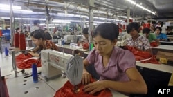 Myanmar laborers work in a garment factory on the outskirts of Yangon.