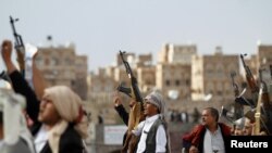 FILE - Houthi supporters attend a rally to mark the first anniversary of the killing of Saleh al-Sammad, who was the head of the Houthi movement's Supreme Political Council, in an airstrike, in Sanaa, Yemen, April 19, 2019.