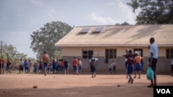 FILE - Pupils of Coburwas primary school, mainly refugees from Congo in Kyangwali refugee settlement in western Uganda, on March 27, 2018.