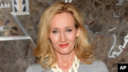 FILE - "Harry Potter" author J.K. Rowling urges fans of the books not to buy a stolen postcard on which she wrote a short prequel. It was sold at charity auction in 2008 and stolen in mid-April.
