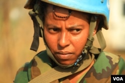 A soldier from United Nations Mission in South Sudan (UNMISS) Ethiopian division patrols the perimeter of protection of civilians (POC) site in Juba, South Sudan, Dec. 5, 2016. (J. Craig/VOA)