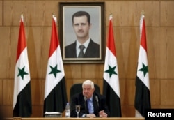 Syria's Foreign Minister Walid Muallem speaks during a news conference in Damascus, Syria, March 12, 2016.