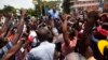 Former Presidential candidate Moise Jean-Charles from the Platform Pitit Dessalines party, is carried by supporters after national police officers attempted to detain him in Delmas, a district of Port-au-Prince, Haiti, Sept. 13, 2017. 