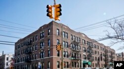 FILE - This March 15, 2018 photo shows apartment buildings in the Astoria section of Queens, N.Y.