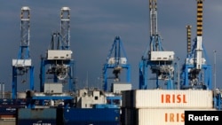 FILE - Empty Islamic Republic of Iran Shipping Lines containers are seen at Malta Freeport in the Port of Marsaxlokk outside Valletta, Feb. 10, 2012. 