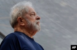 FILE - Former Brazilian President Luiz Inacio Lula da Silva looks on before speaking to supporters outside the Metal Workers Union headquarters in Sao Bernardo do Campo, Brazil, April 7, 2018.